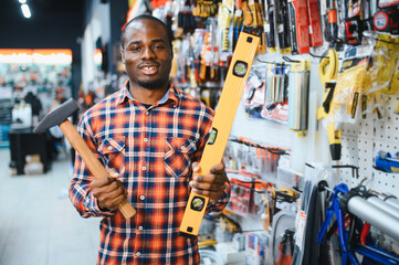 African american man standing in hardware store