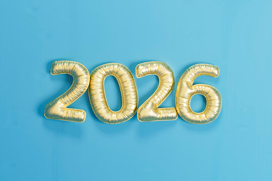 3D golden balloons forming 2026 on blue background