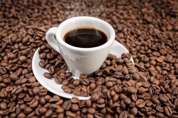 Espresso Coffee cup on roasted beans background
