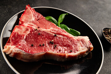 Raw steak T-bone fresh meat premium beef snack fresh delicious gourmet food background on the table rustic food top view copy space