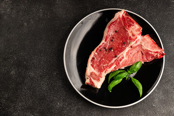 Raw steak T-bone fresh meat premium beef snack fresh delicious gourmet food background on the table rustic food top view copy space