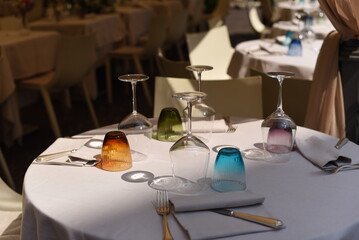 Elegant table setting featuring colorful glassware in a fine dining restaurant during the afternoon