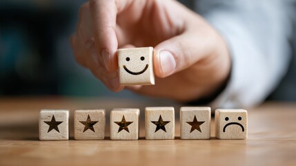Customer Satisfaction Concept: A hand selects a block with a smiley face, arranging a sequence of rating blocks, to convey concepts of experience and review
