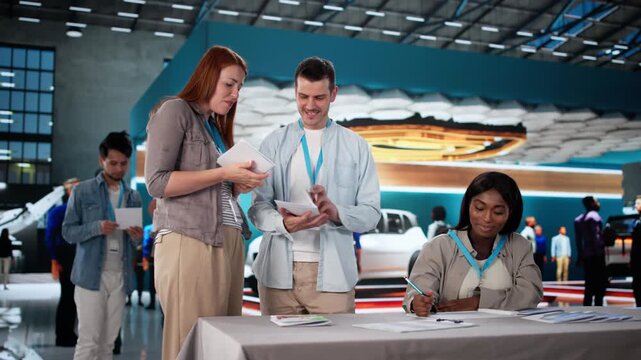Talking With Visitors And Trade Show. Presenting Company