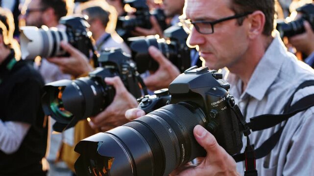 Professional photographers testing new digital cameras with telephoto lenses during product launch, capturing precise images with expertise under golden sunlight
