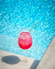Cocktail with a swimming pool in the background