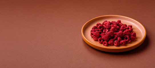 Dried sublimated slices of raspberry as an ingredient for sweet desserts. Dried raspberry