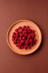 Dried sublimated slices of raspberry as an ingredient for sweet desserts. Dried raspberry