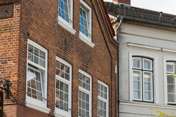 Historic townscape of Preetz, Germany, showcasing traditional red brick houses, a medieval tower, and cobblestone streets. A fine example of northern German architectural heritage
