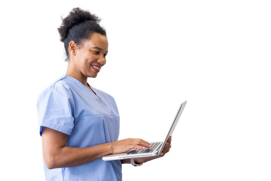 Smiling medical professional working on a laptop, showcasing expertise in healthcare while isolated on a transparent background