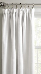 Elegant white curtains hanging from a silver curtain rod, softly draping beside a window, allowing natural light to filter into the room, enhancing the serene atmosphere of the interior space