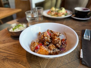 Bowl of Asian chicken with sesame seeds and vegetables