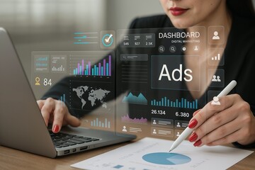 Businesswoman working on laptop with futuristic digital dashboard showing ads, charts, and analytics. Concept of digital marketing, online advertising, and modern business data analysis.