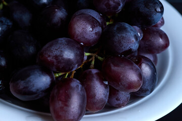 Macro grapes photo showing juicy berries in cluster