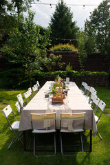 Garden party table setup with chairs
