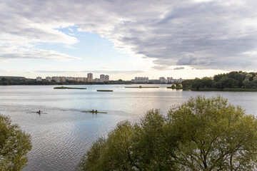 People practicing rowing on the lake. Sports