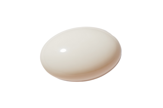 Cream-colored, polished, round object.  Smooth, glossy surface.  Perfect sphere, subtle shadow