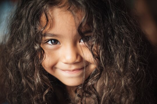 Close up portrait of a smiling Hispanic girl