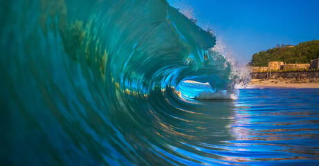 Inside curling ocean wave with sunlight reflections
Close-up view inside a curling ocean wave with...