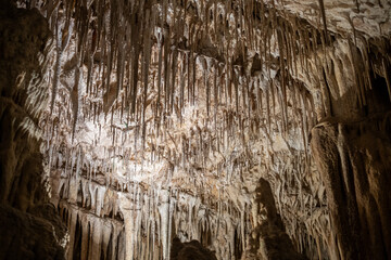 Stunning stalactites and stalagmites in a mysterious underground cave