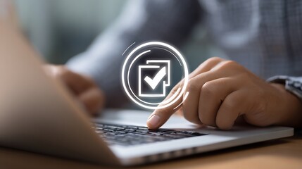 Fototapeta premium Person using laptop, with digital checkmark icon hovering. Close-up of hand pressing key