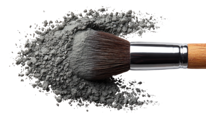 A makeup brush dipped in gray powder, scattered