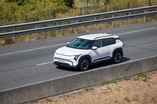 White kia niro driving on the highway