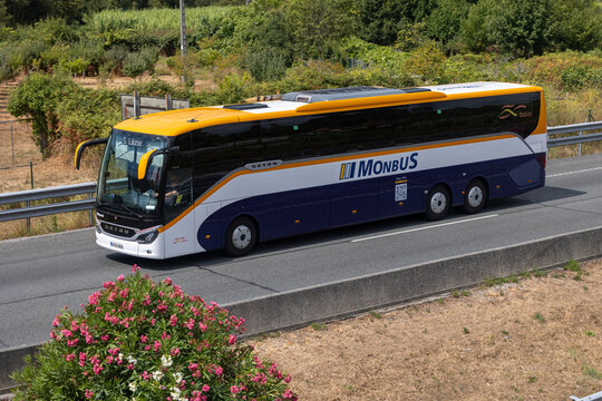 Monbus coach traveling on highway in summer