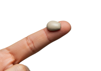 Precisely defined small scoop of neutral matte clay pomade, textured, held by a clean male fingertip on blurred transparent, professional hair care product demonstration