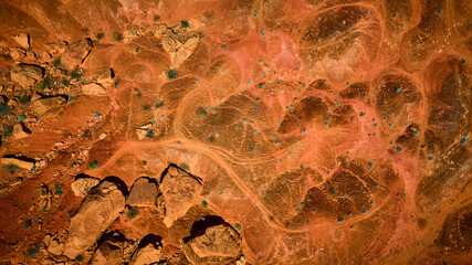 Aerial Red Rock Desert Terrain With Boulder Formations And Sparse Vegetation © Nicholas J. Klein