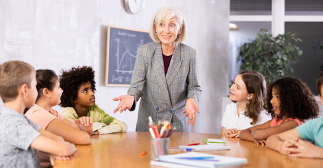 Kids sitting patiently in classroom learing new things