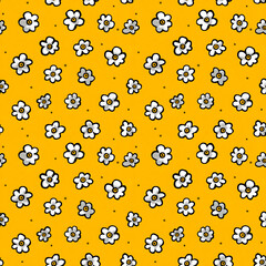 Seamless doodle pattern with dense white flowers on yellow background, hand drawn cartoon floral design