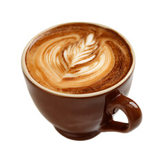 A brown mug holds a latte with an ornate leaf design created using milk foam showcasing the artistry and detail in the cup