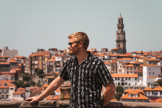 Male model on holiday in Europe, summer fashion black shirt and sunglasses