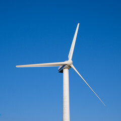 wind turbine on blue sky background
