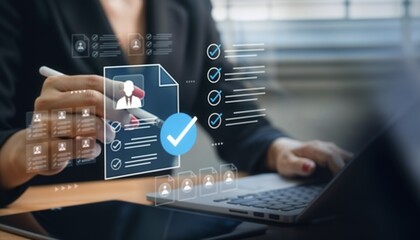 Businesswoman reviewing digital profile and checklist on a virtual screen while working on laptop. Concept of recruitment, human resources, employee selection, and digital business management.