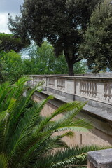 Classical Roman terrace with marble balustrade, palm trees and Mediterranean landscaping