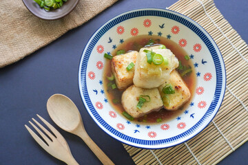 Agedashi Tofu is a spicy fried tofu dish from Japan. Silken tofu or silken bean curd, kinugoshi, is diced and then sprinkled with potato starch or cornstarch.