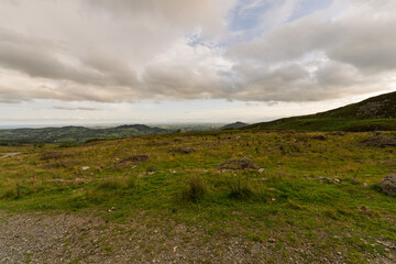 A large, open field with a cloudy sky in the background