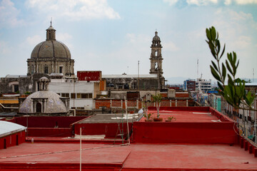 Roof top view of Puebla Churches with domes and towers © larry