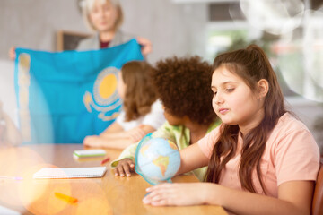 Kids learning together about kazakhstan in geography class