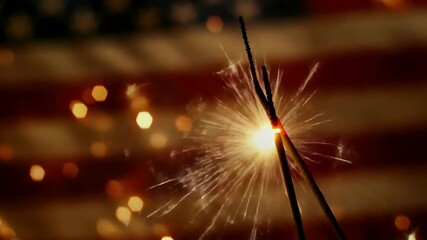 American flag with fireworks exploding in the background, symbolizing national celebration and pride.