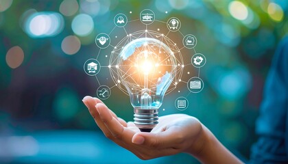Hand holding lightbulb, business icons
