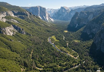 Obraz premium Aerial Drone View of Yosemite Valley with Lush Greenery and Winding River in Bright Daylight