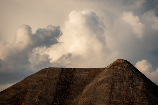 clouds over a thatch roof in the Maldives