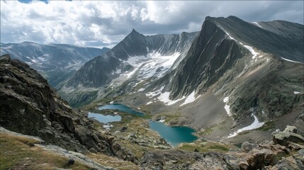 sharp rocky ridge with glacial lakes in mountain landscape