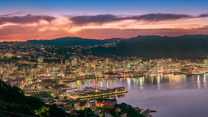 Downtown Wellington city buildings and harbour from Mount Victoria at dusk.