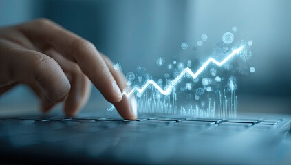 Hand touching a growing graph on a laptop