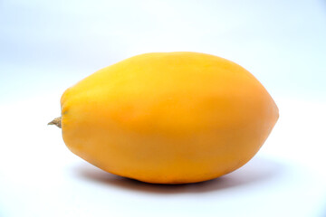 A ripe papaya fruit with vibrant yellow orange skin placed on a white background, showing its natural freshness, tropical flavor, and healthy appeal.