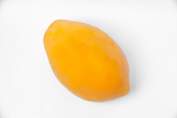 A single ripe papaya fruit with bright yellow orange skin on white background, symbolizing tropical freshness, natural nutrition, sweet flavor, and healthy lifestyle.